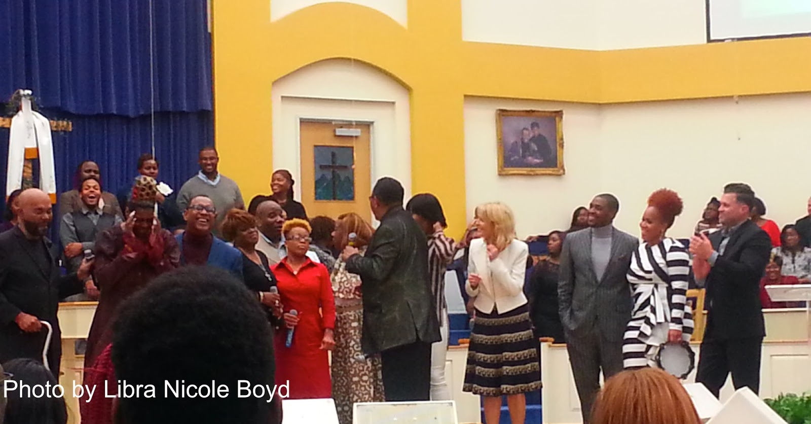 Dr. Bobby Jones (front) with (left to right): Bernard Sterling, Biddy Newborn, Melvin Williams, Tammy Caesar, Anthony Hill, LeDehra Alston, Beverly Crawford, Le'Andria Johnson, Ami Rushes, Teddy Campbell, Tina Campbell, Wess Morgan, and Mt. Calvary Word of Faith Choir (background). Not pictured: Arie Pope.