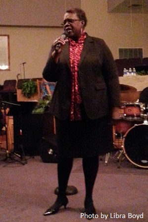 Theresa Burton-Richmond of the Angelic Gospel Singers sings at Greater Cleggs Chapel Community Missionary Baptist Church.